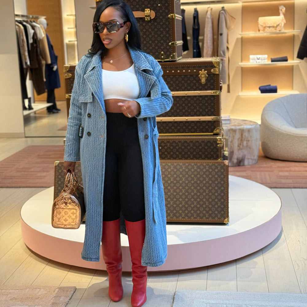 Women's loose denim trench coat by eprolo with long sleeves and belt, styled for street fashion, shown front view.