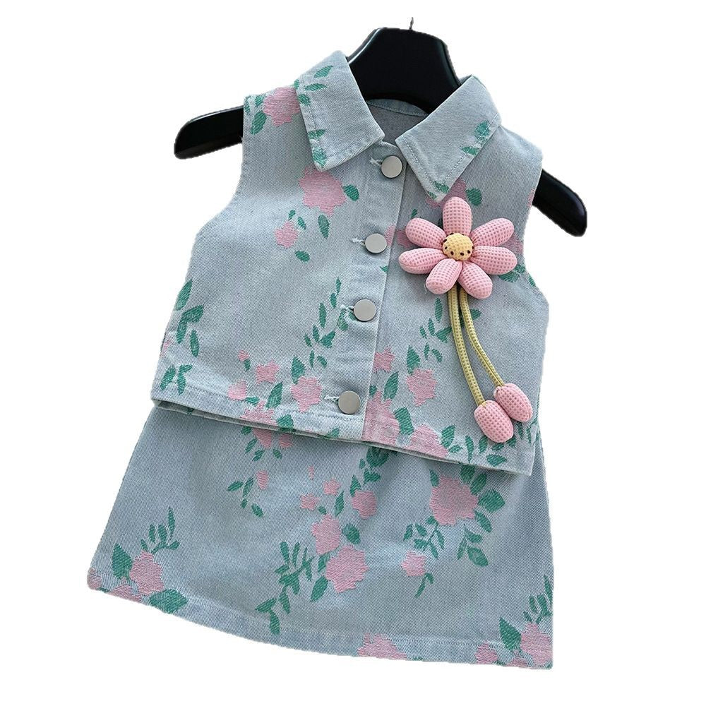 Light blue denim skirt set with pink floral pattern, button-up vest, collar, and large pink flower pin.