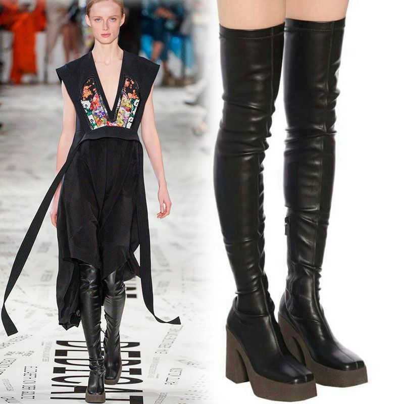 Black leather over-the-knee platform boots with thick block heels, shown on runway and alone.