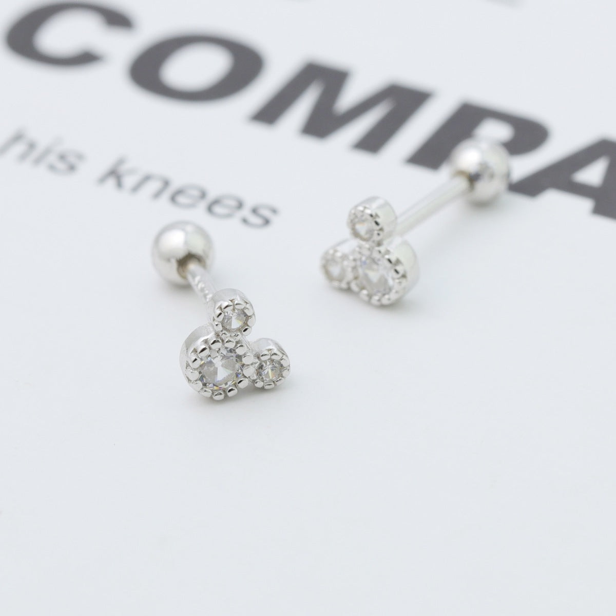 Plush Fashion Hub Mickey Mouse stud earrings featuring classic cartoon character in gold tone on a white background.