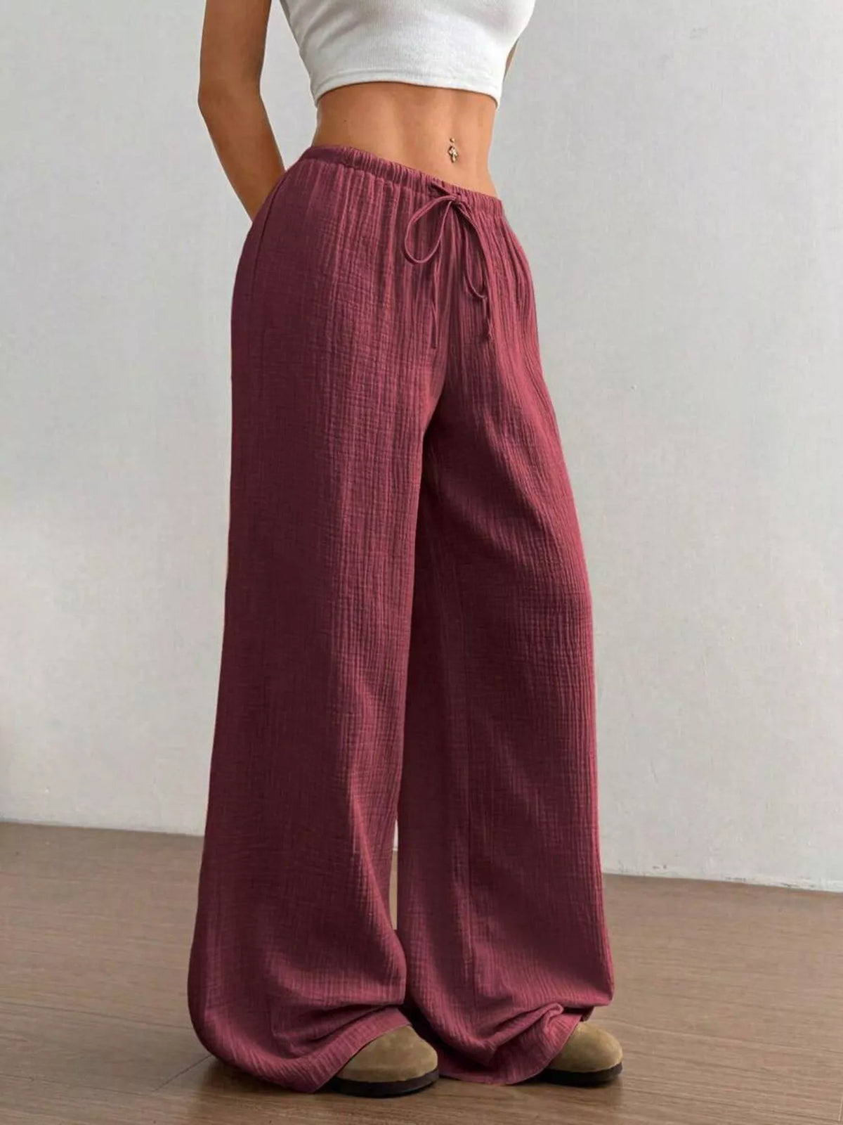 Plush Fashion Hub wide-leg drawstring pants in soft fabric, featuring a relaxed fit and casual style.