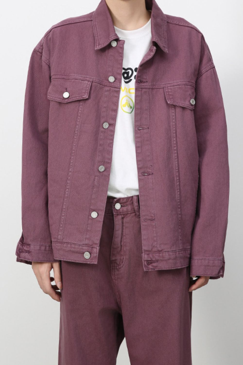 Men's dropped shoulder denim jacket by Plush Fashion Hub, featuring button-up front and casual style, shown on a model.