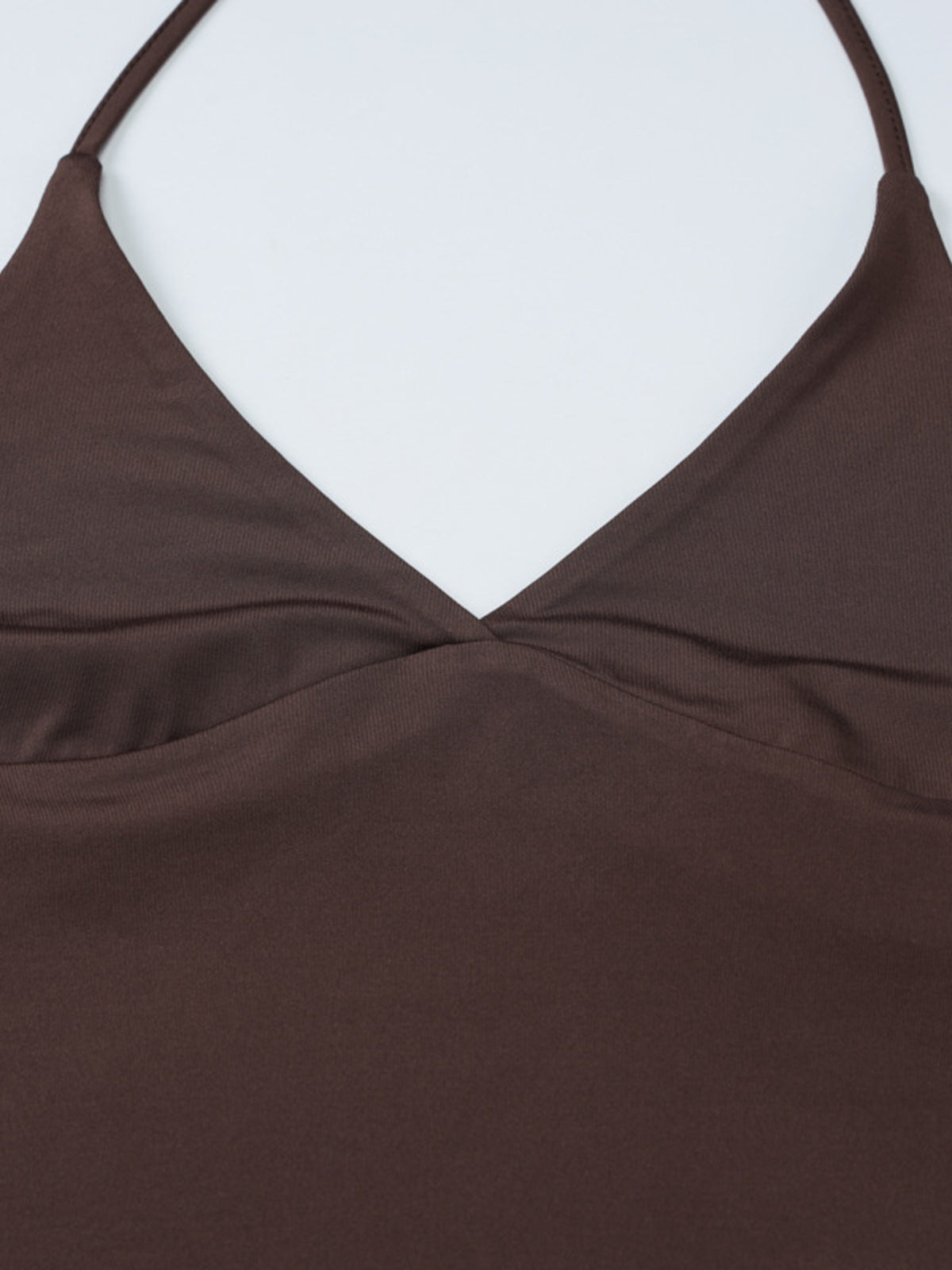 Women's halter neck slim fit cami tank top by Plush Fashion Hub, shown in black with sleeveless design and fitted silhouette.