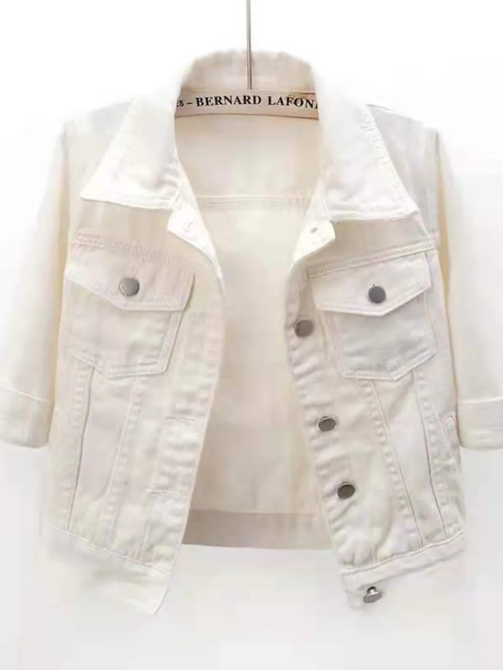Plus size full length cropped denim jacket from Trendsi, showcasing the classic blue denim with front pockets and button closure.