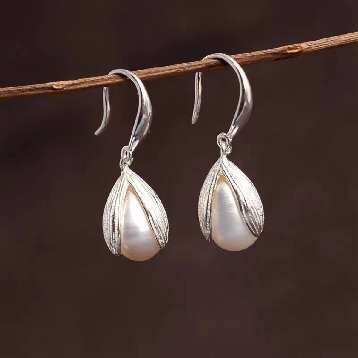 Sterling silver drop earrings from Plush Fashion Hub featuring elegant, dangling jewelry with a polished finish.