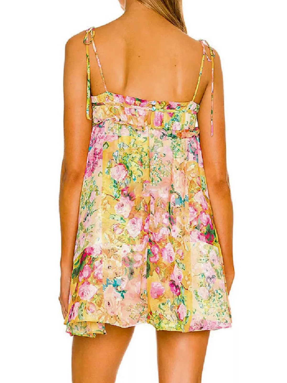Floral print tie-shoulder mini dress by Plush Fashion Hub, featuring a colorful pattern and stylish design on a woman wearing it.