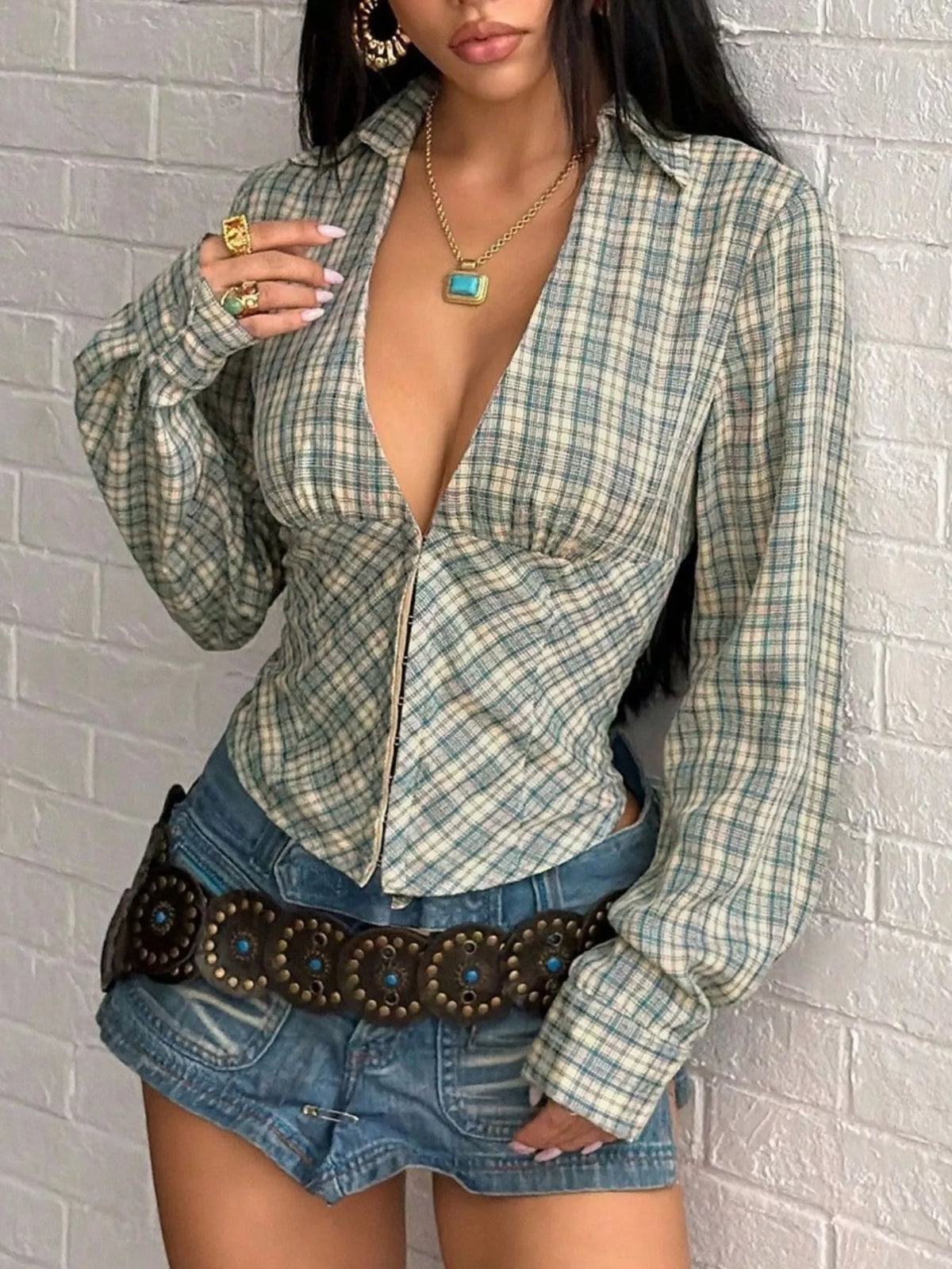 Plaid deep V-neck long sleeve slim fit blouse from Trendsi featuring a stylish pattern and tailored fit.