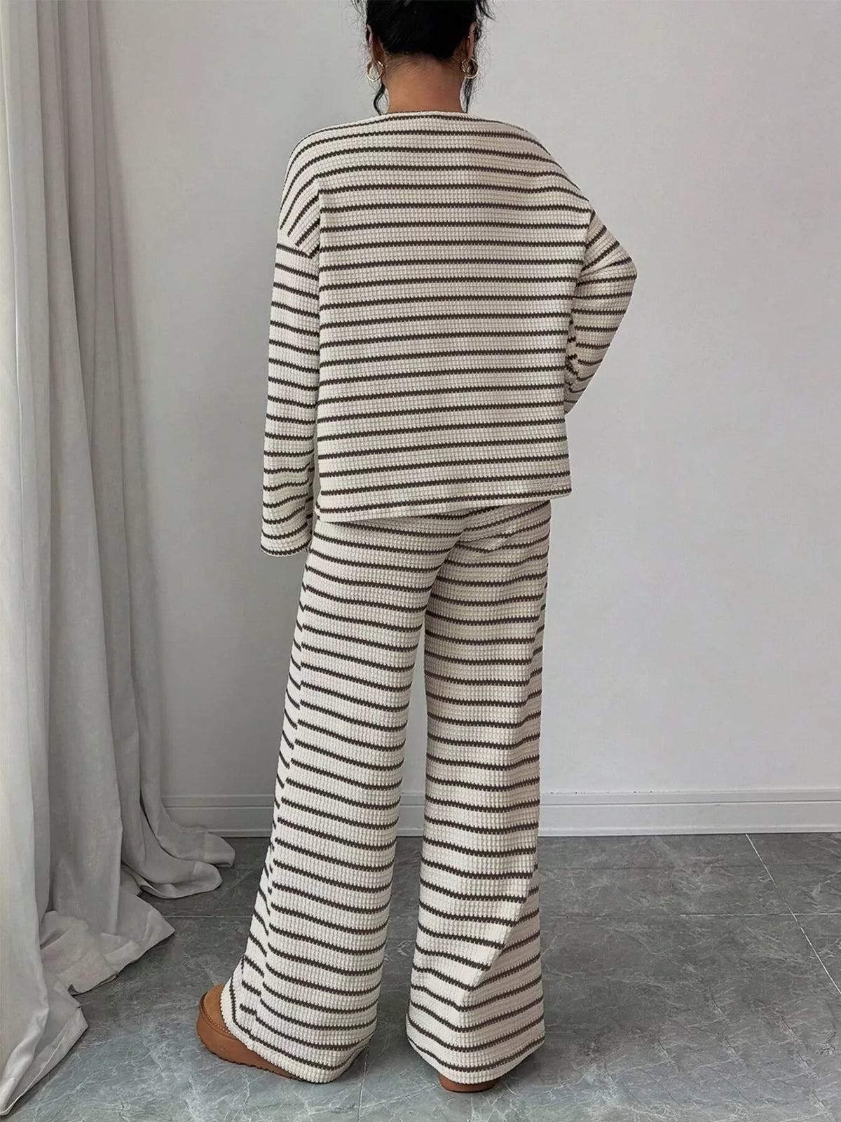 Striped knit dropped shoulder top and matching pants set by Trendsi, featuring a relaxed fit and casual style.