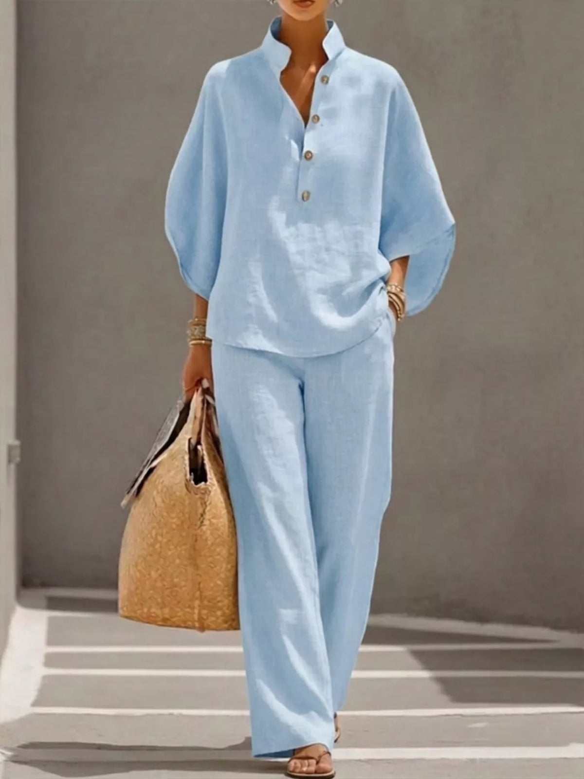 Women's plus size two-piece dress set by Plush Fashion Hub with button details, 3/4 sleeve top and matching pants.