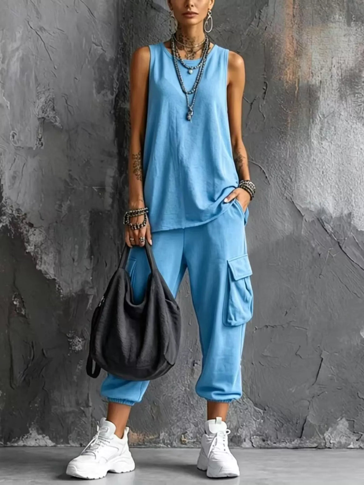 Plus size casual tank top and cargo pants set by Trendsi, featuring a relaxed fit and comfortable fabric in a full-size ensemble.