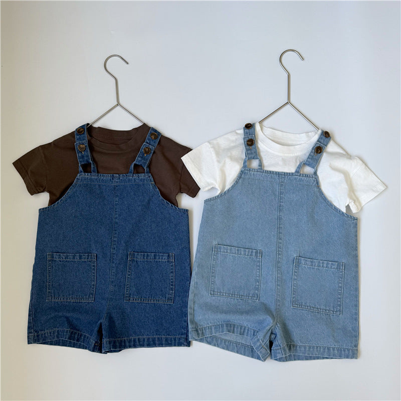 Two sets of denim overalls with t-shirts hanging, dark blue and light blue with brown buttons and front pockets.