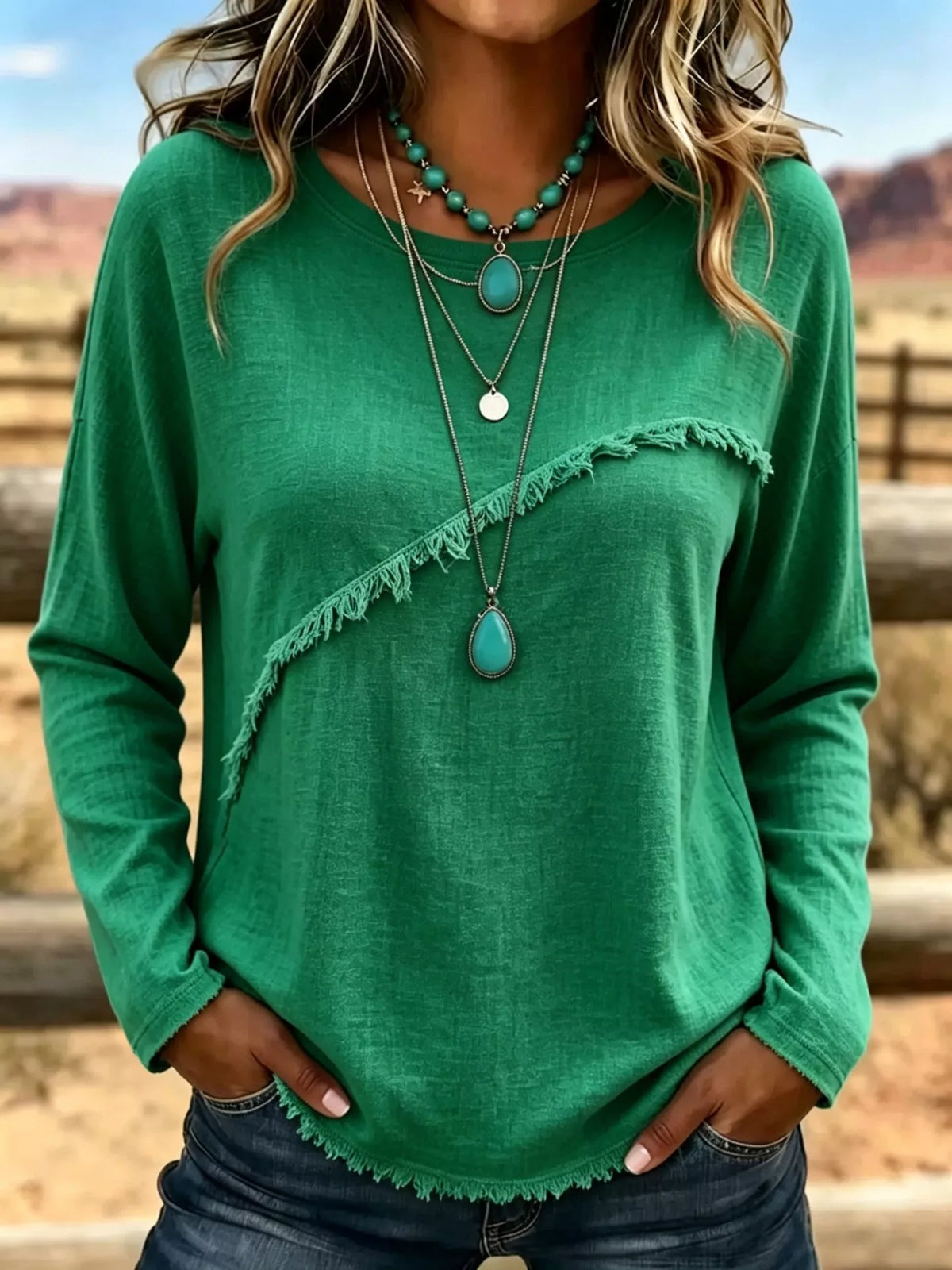 Plus size long sleeve fringe detail T-shirt from Trendsi, featuring a comfortable fit and stylish fringe accents on the sleeves.