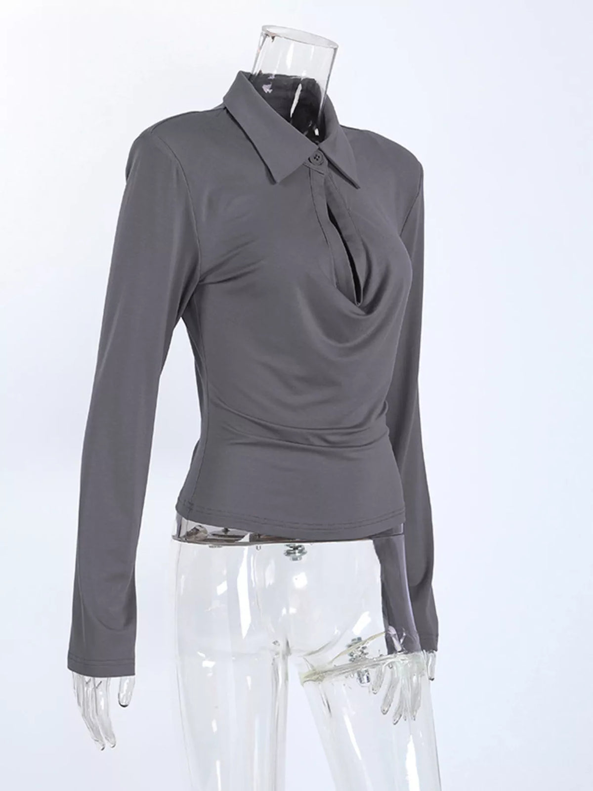 Slim-fit long-sleeve T-shirt with cutout detail by Trendsi, featuring a modern design and sleek silhouette.