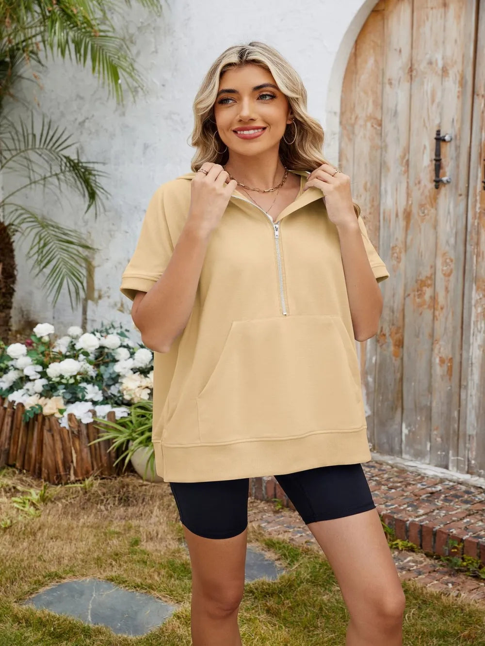 Pink short sleeve hooded half zip top by Plush Fashion Hub, showing the front view with a relaxed fit and lightweight fabric.