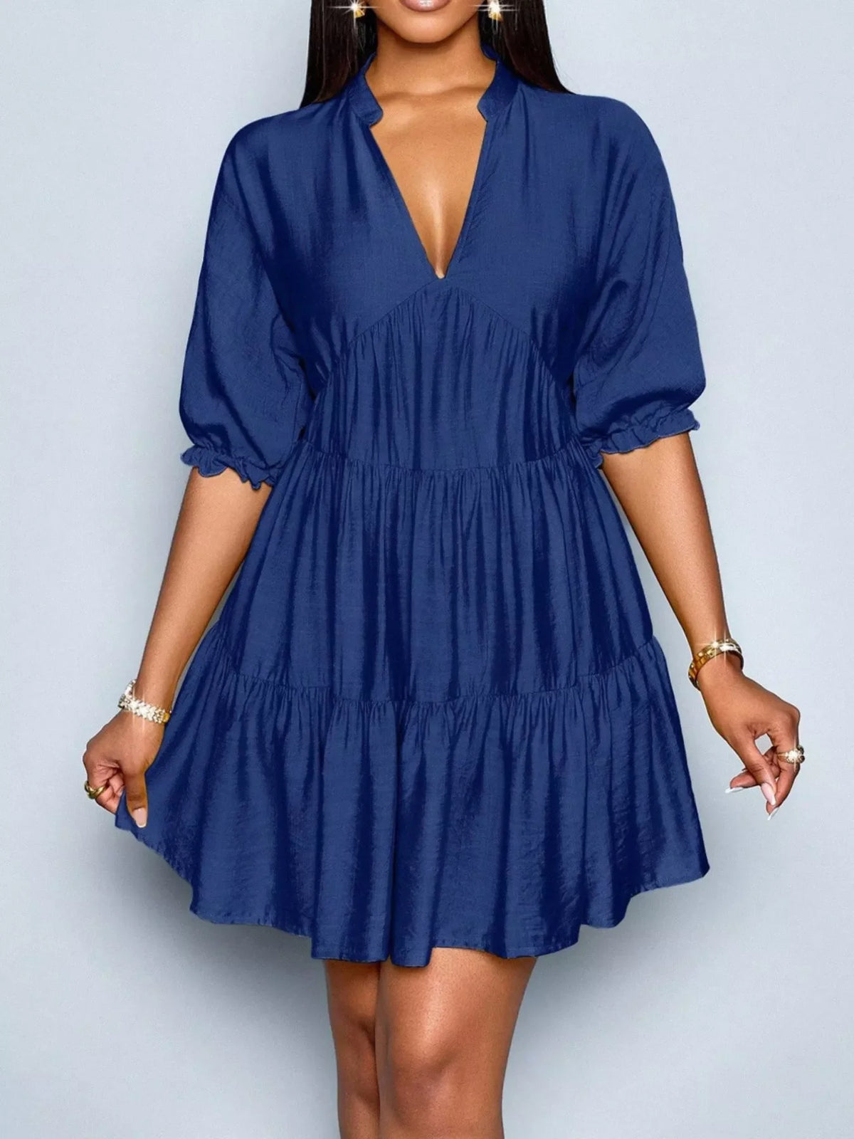 Notched half sleeve tiered dress by Plush Fashion Hub featuring a stylish design and flowing fabric.