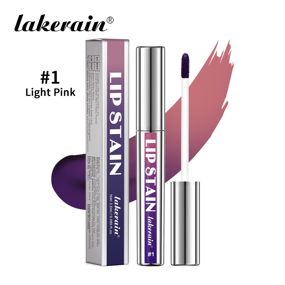Lakerain lip stain in light pink, featuring a silver tube, applicator, and matching box with purple gradient text.