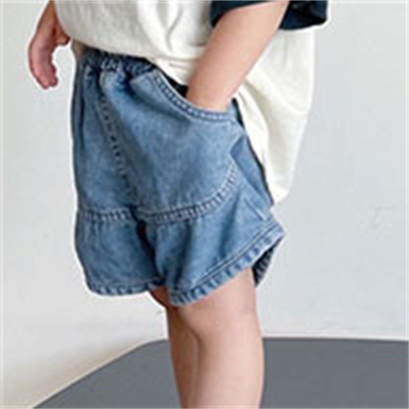 Blue denim shorts with an elastic waistband and large front pockets.