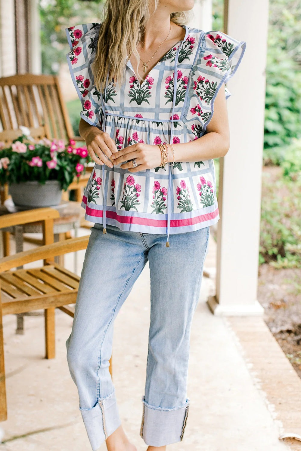 Women’s floral print ruffle sleeve blouse with tied neckline, lightweight fabric, from Plush Fashion Hub.