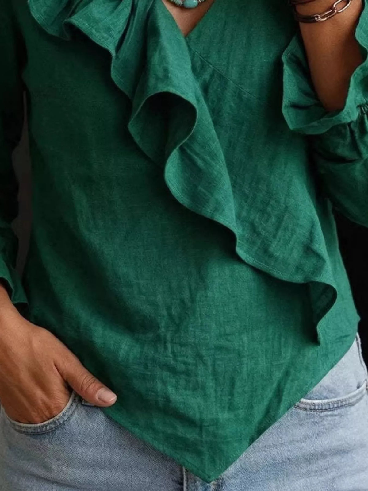 Plus size long sleeve ruffled blouse from Trendsi, featuring a flowy fit and decorative ruffles on the sleeves.