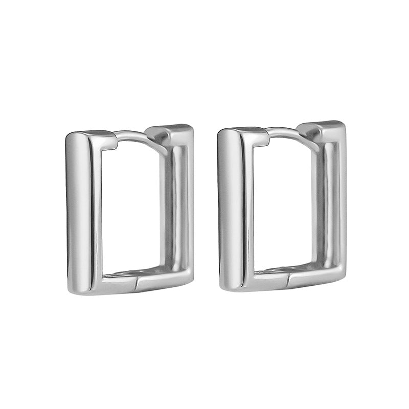 Silver huggie hoop earrings with a rectangular, geometric style and smooth metallic finish.
