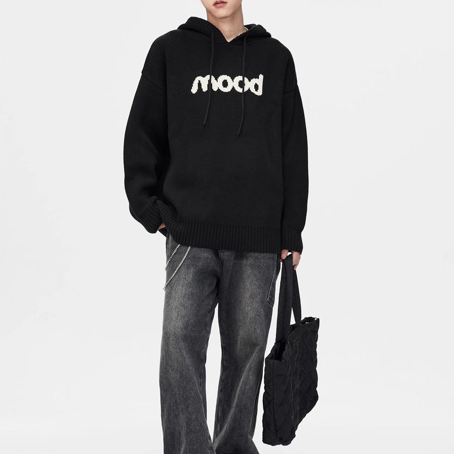 Black knit hoodie with the white word "mood" on the chest, a hood with drawstrings, and ribbed cuffs and hem.