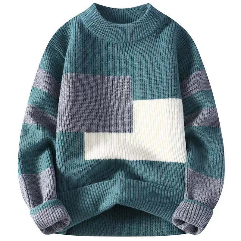 Teal knit sweater with grey and white colorblock design and striped sleeves, ribbed crewneck, cuffs, and hem.
