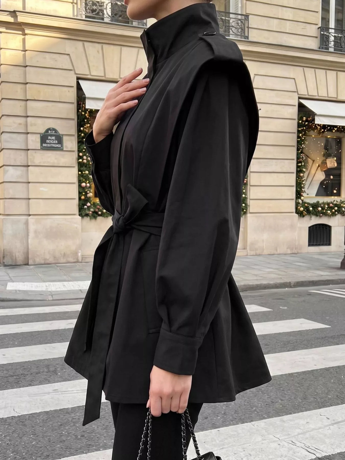 Trendsi stand-collar belted outerwear jacket featuring a sleek design and button closure, shown in a neutral tone.