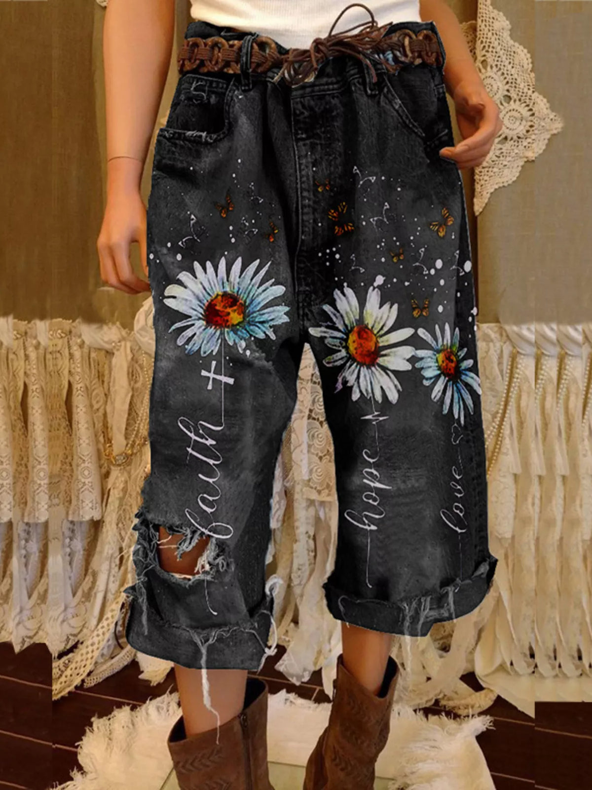 Full size floral distressed cropped jeans by Trendsi, showcasing a trendy, fitted denim style with floral embroidery and distressed details.