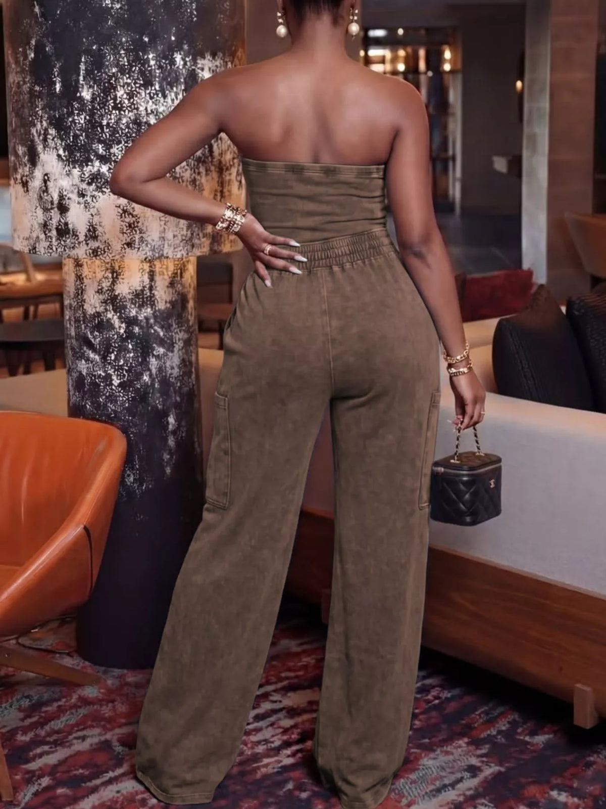 Trendsi drawstring strapless wide-leg jumpsuit, featuring a relaxed fit, wide legs, and a stylish strapless design.