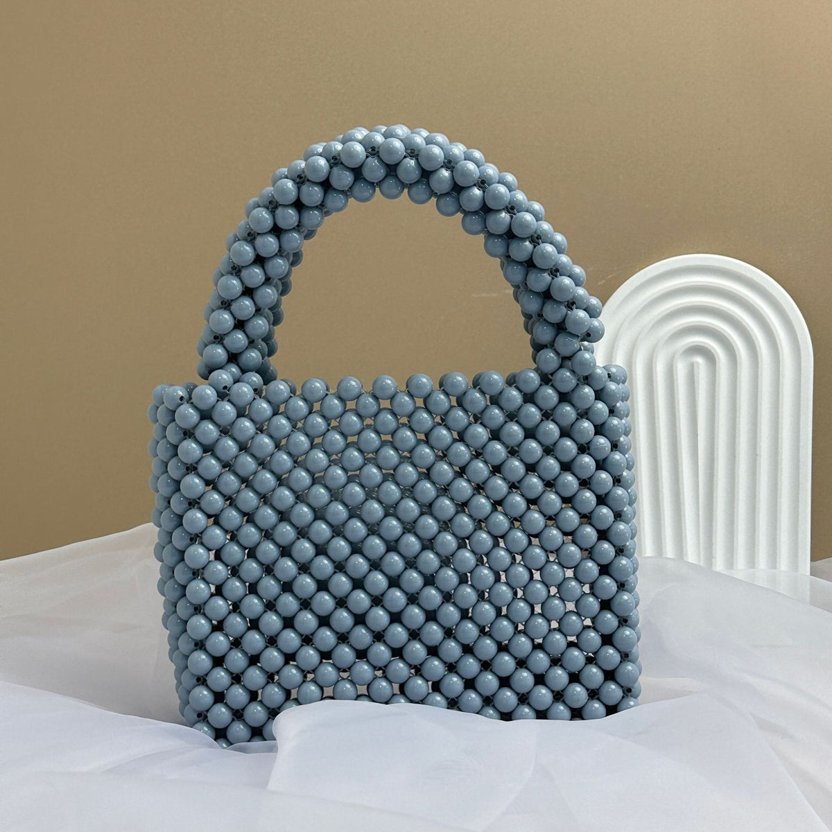 Eprolo beaded handbag with solid color design, featuring intricate beaded details and a stylish hand strap.
