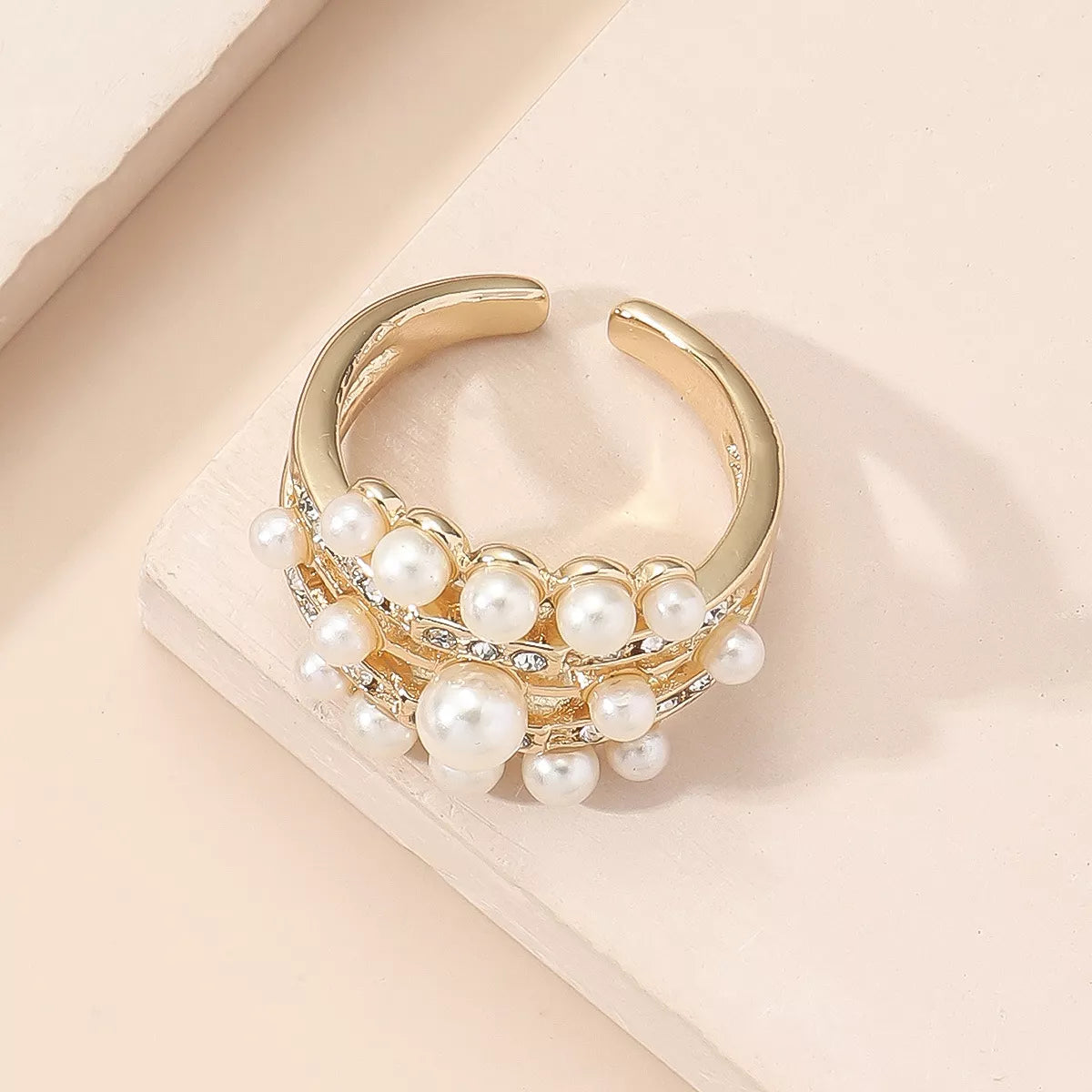 18K gold-plated open pearl ring featuring a sleek design with a lustrous pearl accent, ideal for elegant jewelry style.