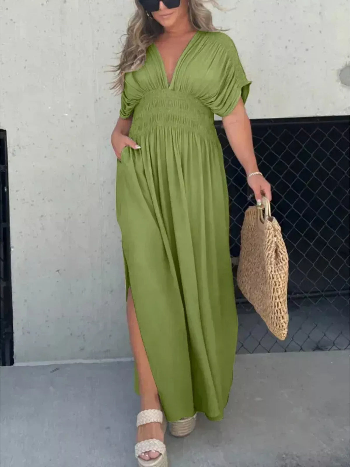 Plus size full slit V-neck maxi dress with smocked waist by Plush Fashion Hub, featuring a flowing silhouette and elegant design.
