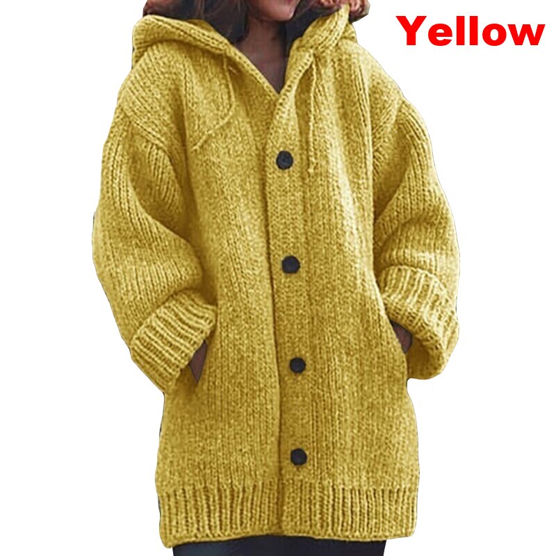 Oversized yellow knit cardigan with a hood, large black buttons, front pockets, and ribbed cuffs.