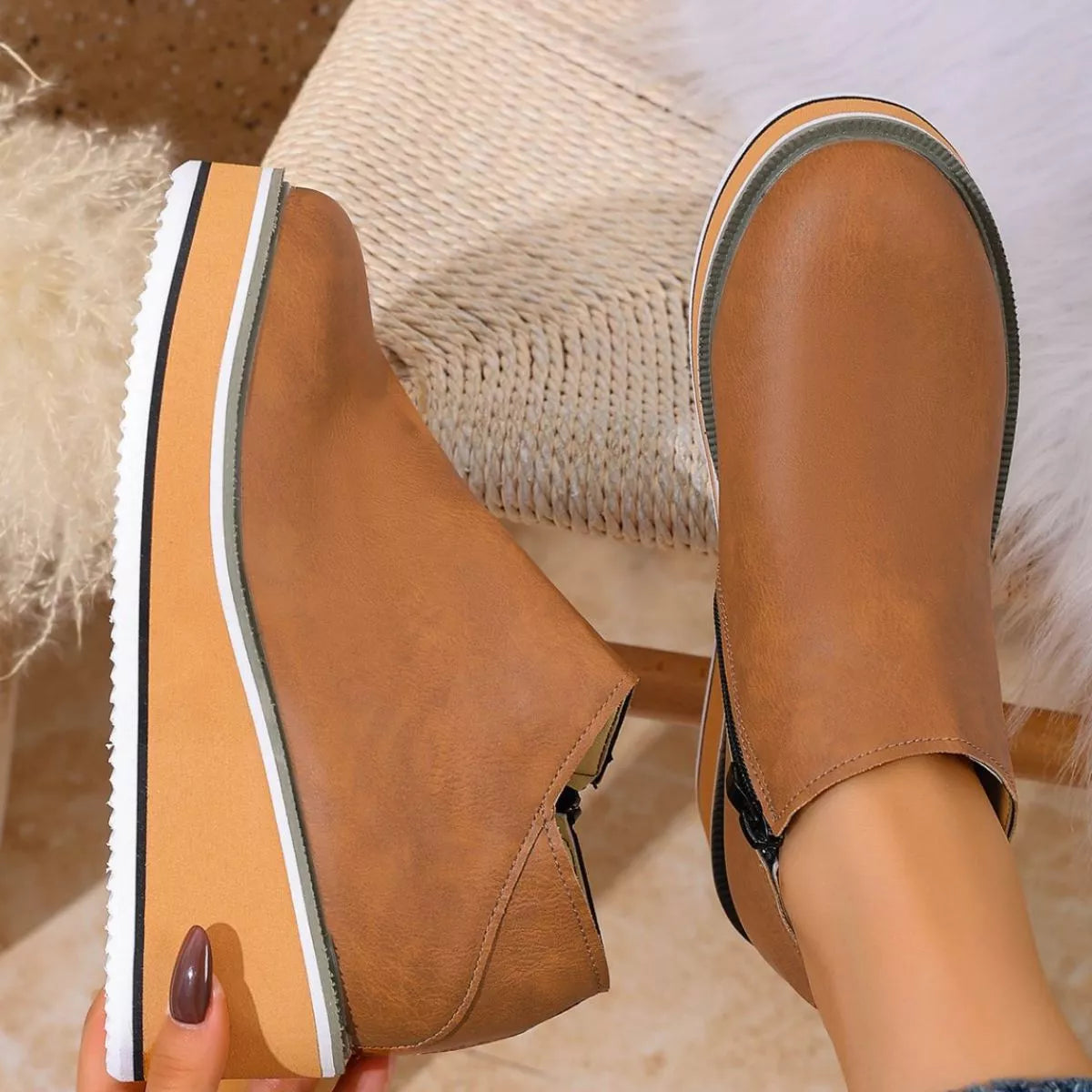 Women's round toe wedge ankle boots by Trendsi featuring stylish design and ankle-high heel, perfect for casual or dressy outfits.