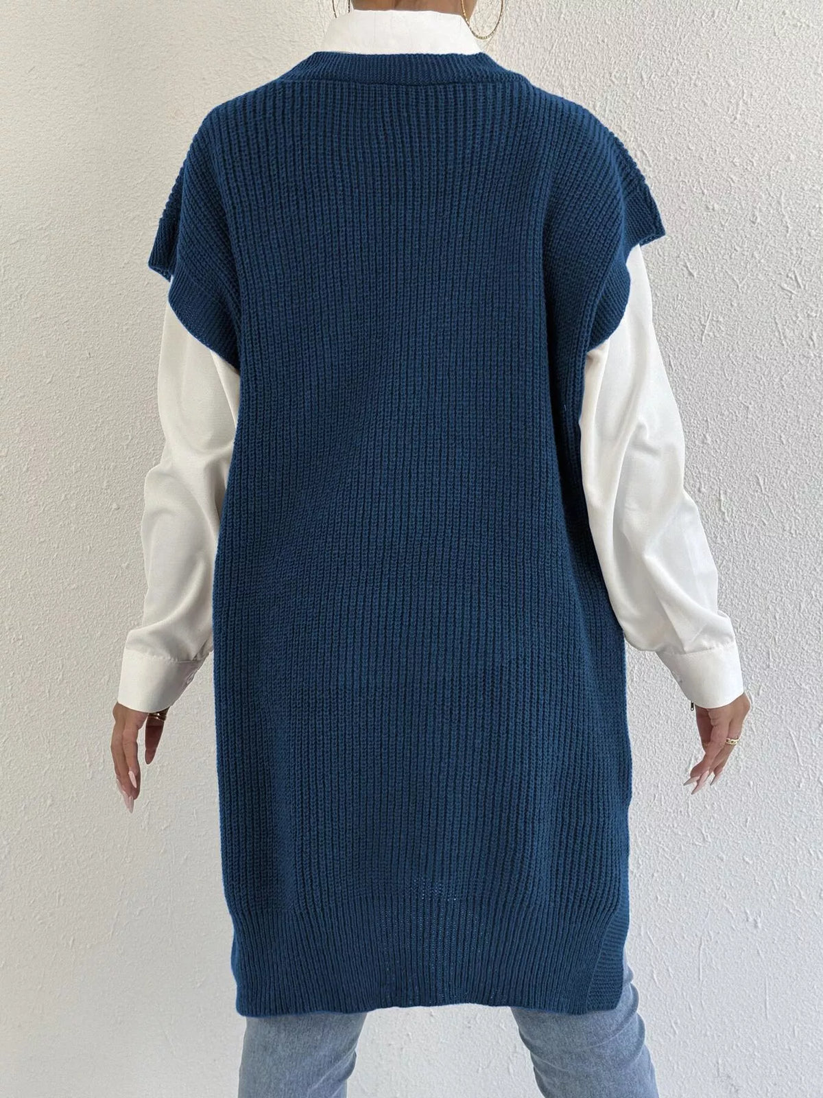 Embroidered bow V-neck sweater vest by Trendsi featuring intricate embroidery and a classic V-neck design.