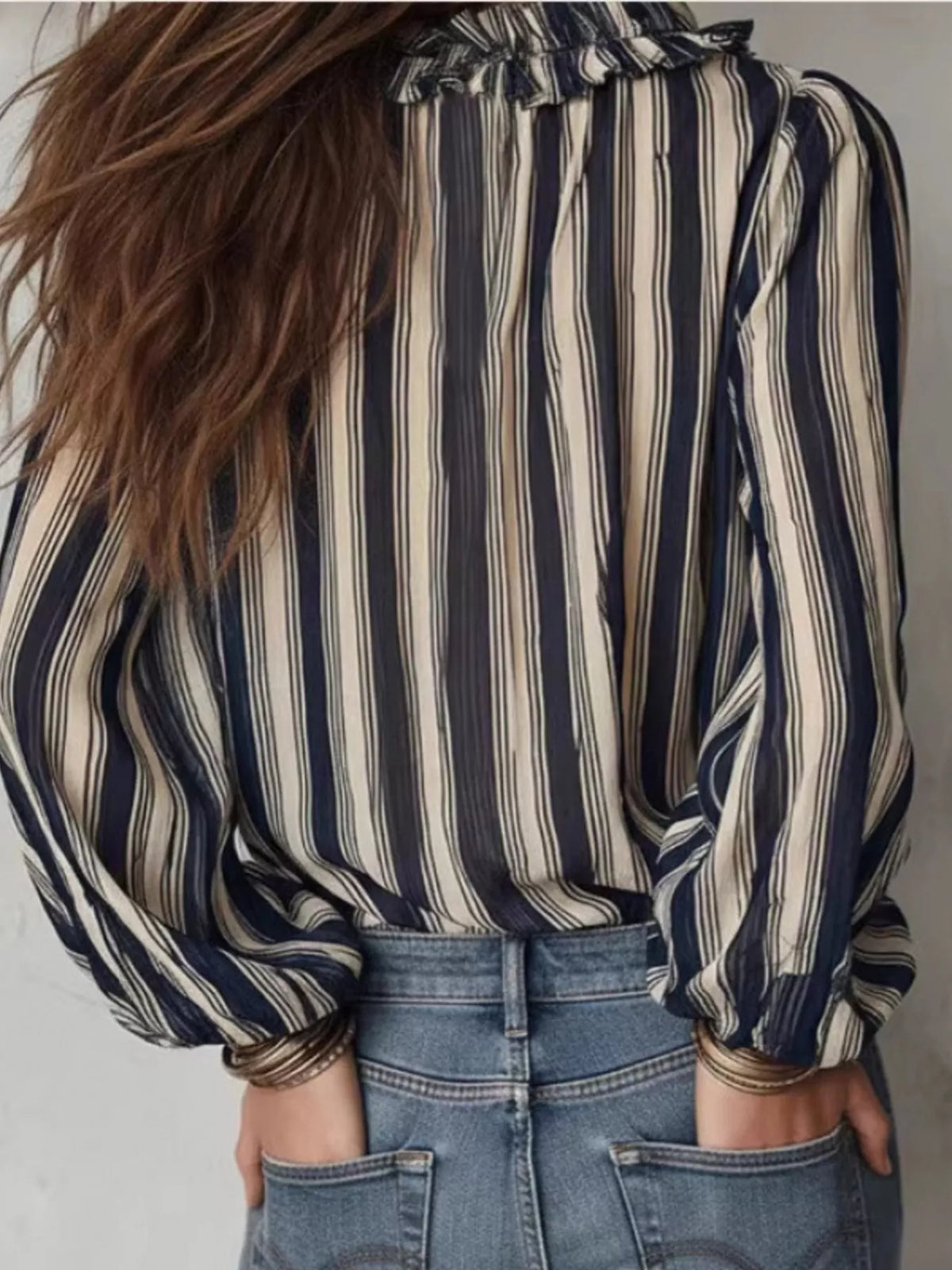 Striped balloon sleeve blouse for women, stylish trendy top with bold horizontal stripes and voluminous sleeves.