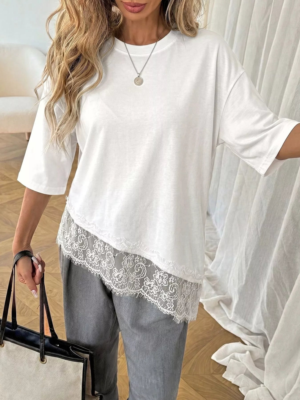 Lace detail half sleeve T-shirt by Plush Fashion Hub featuring soft fabric and stylish design with lace accents on sleeves.