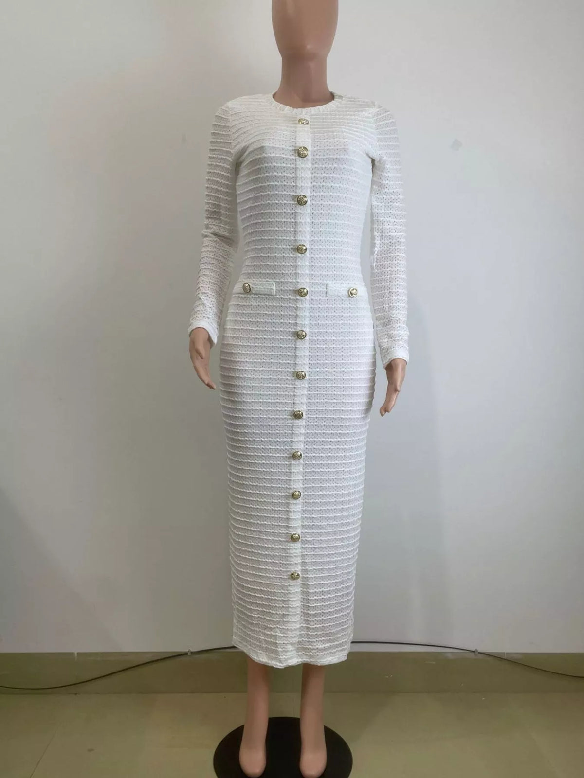 Plush Fashion Hub textured midi dress with decor button details, stylish and comfortable fashion piece in a soft fabric.