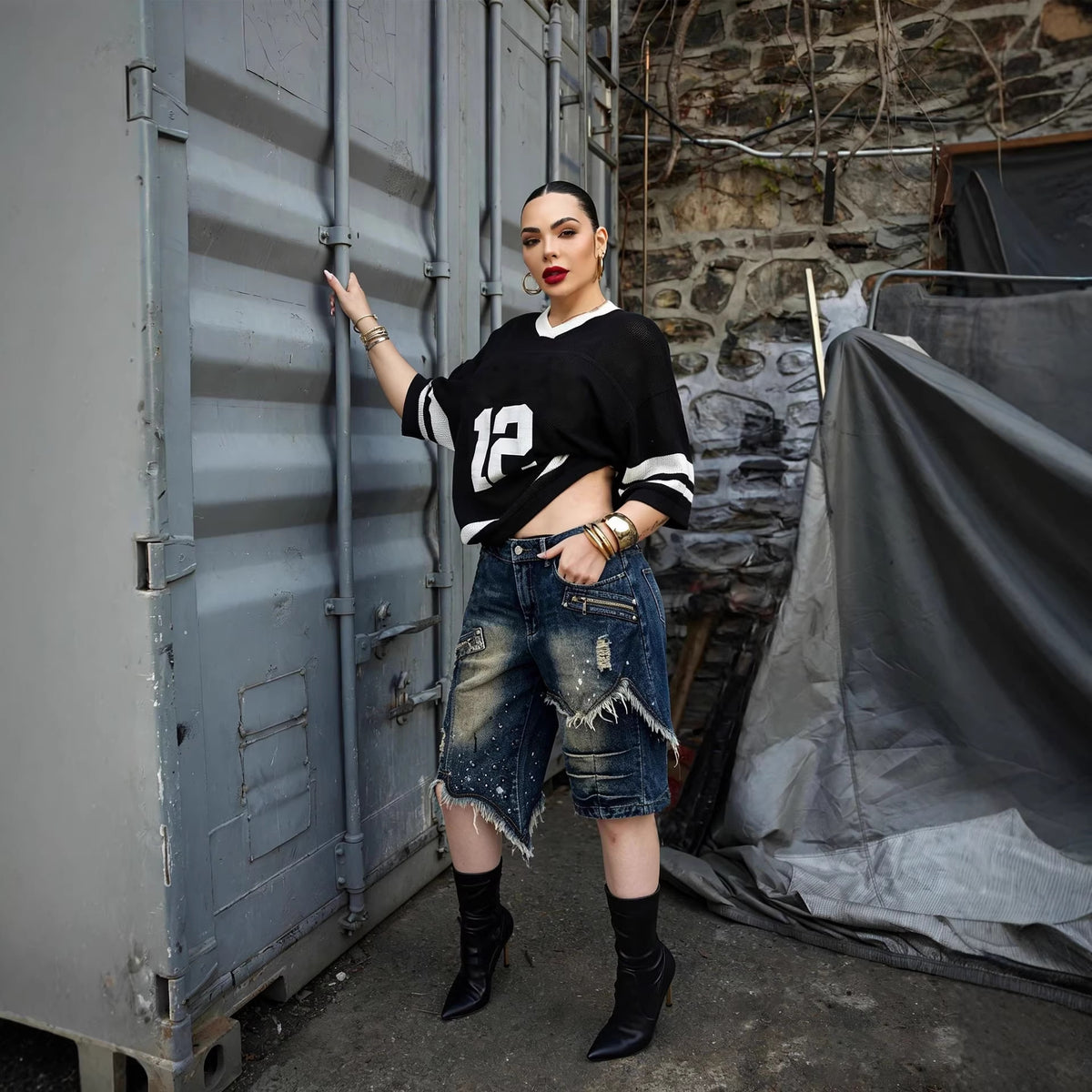 Asymmetric frayed hem denim shorts by Plush Fashion Hub with street style design and distressed details.