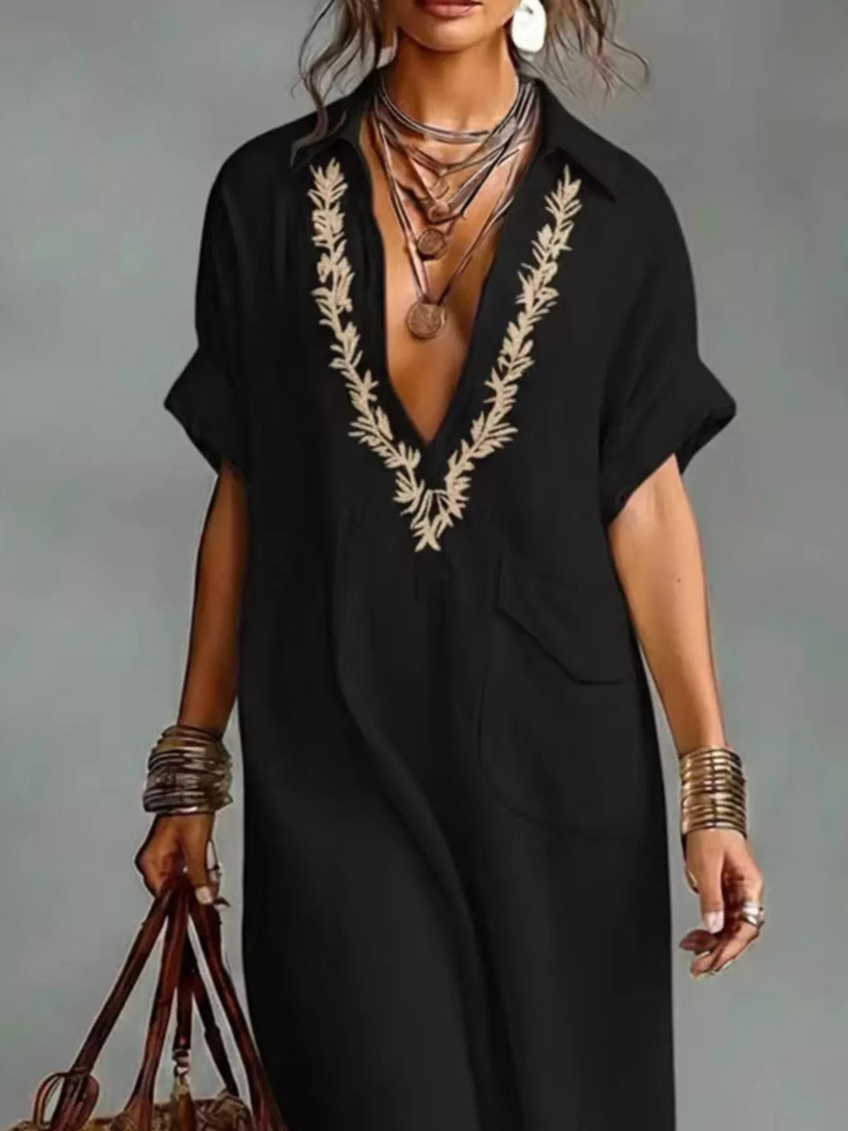 Plus size full-length bohemian embroidered maxi dress with colorful patterns and flowing fabric, perfect for casual or special occasions