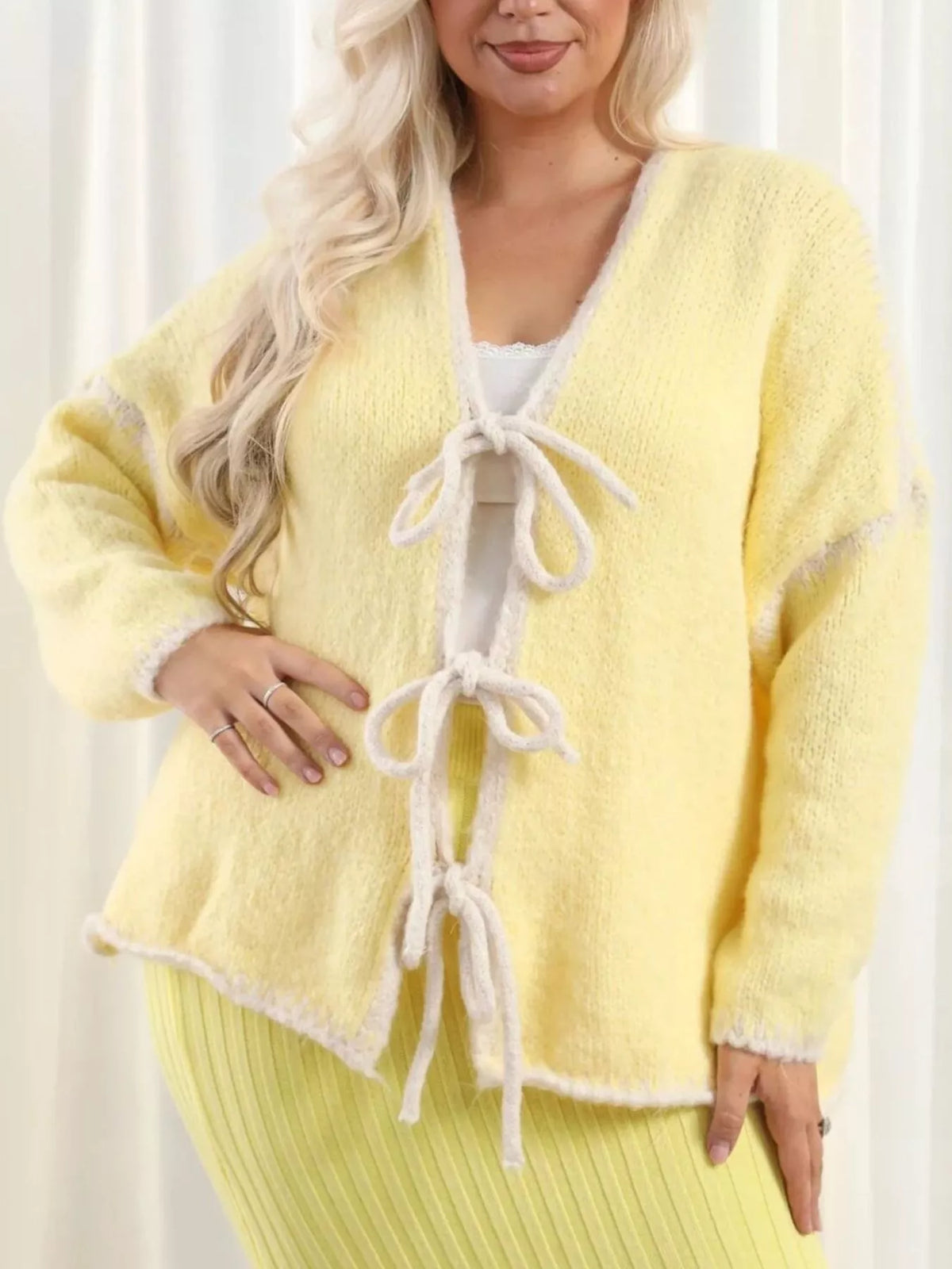 Tie front drop shoulder cardigan by Trendsi, soft knit fabric with long sleeves and a relaxed fit, featuring a stylish tie front design.