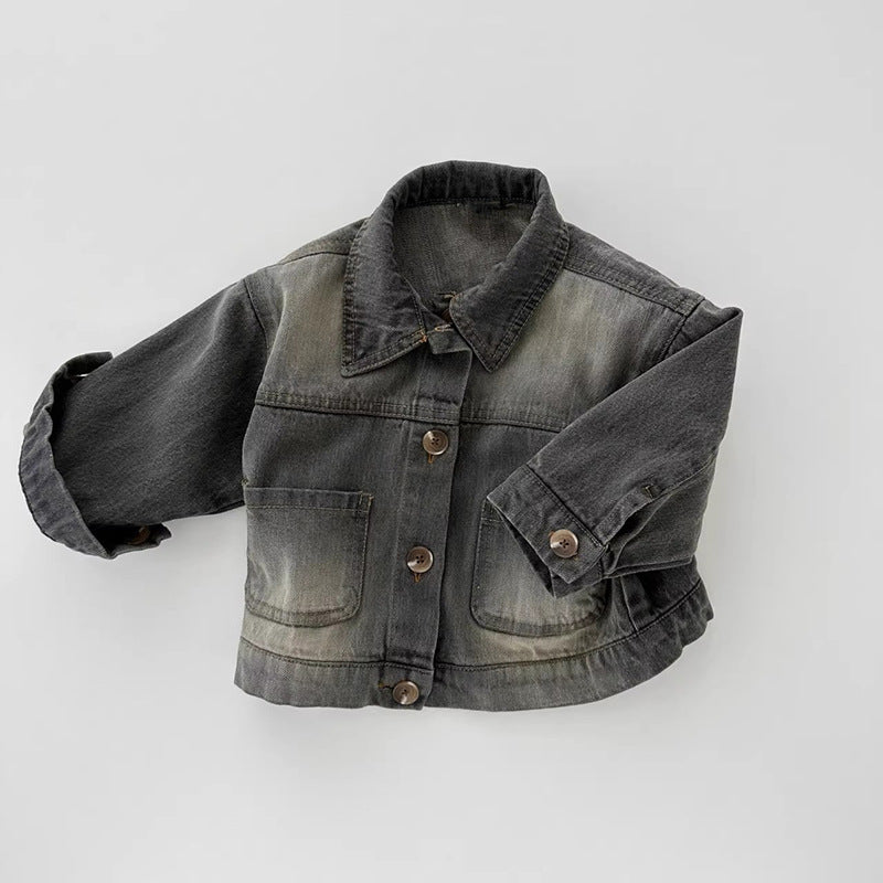Dark grey denim jacket with front buttons, two patch pockets, and a classic collar on a neutral background.