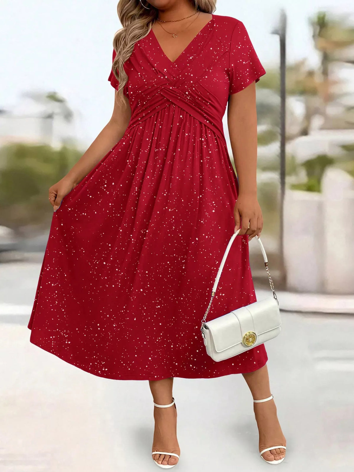 Plus size glitter flutter sleeve midi dress by Trendsi, featuring a shimmering fabric and flowing silhouette for elegant style.