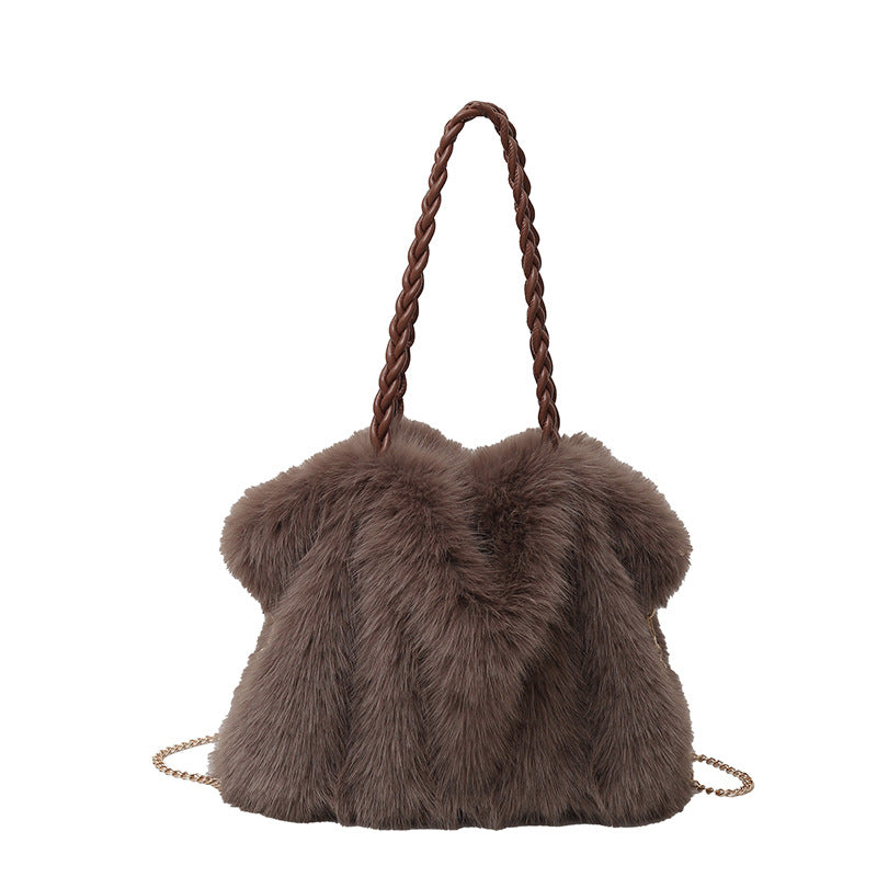 Brown faux fur shoulder bag with braided strap and gold chain detail on a white background.
