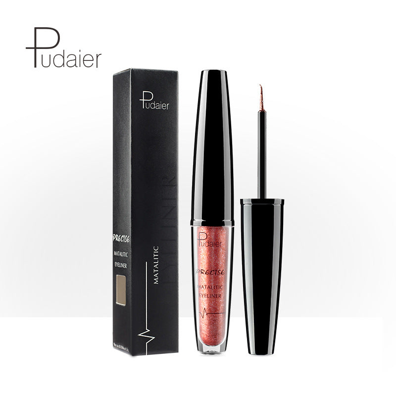 Metallic copper glitter eyeliner with black plastic cap and box, featuring white text and graphic details.