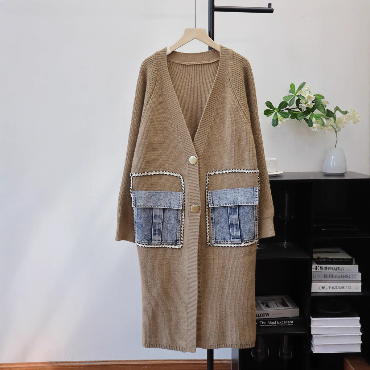 Brown knit long cardigan with V-neck, front buttons, and large denim flap pockets.