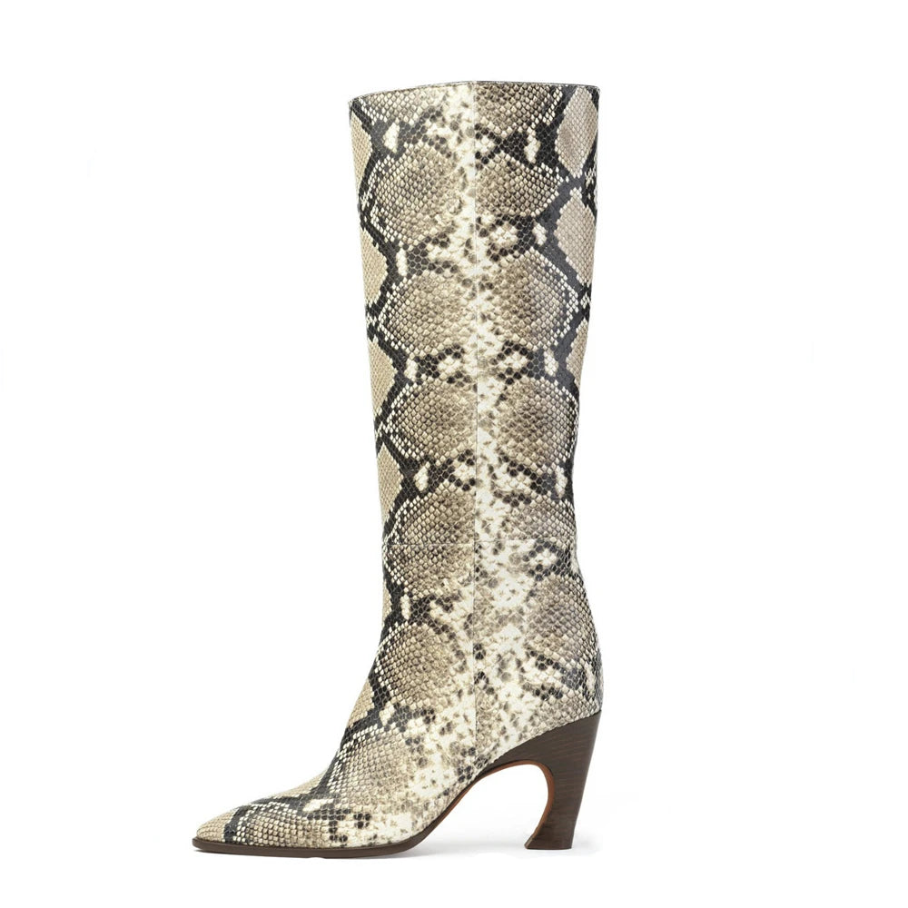 Snakeskin tall boot in beige, black, and white with a pointed toe and flared brown heel.