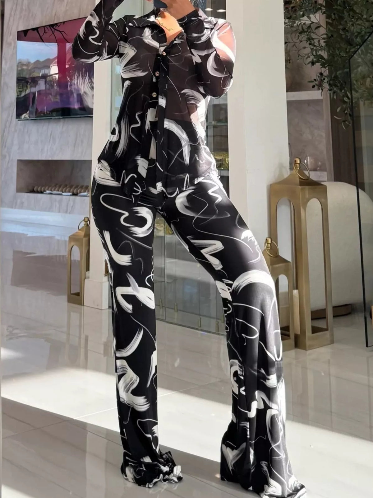 Printed mesh shirt and pants set for women, stylish and breathable, featuring trendy patterns and comfortable fit by Trendsi.