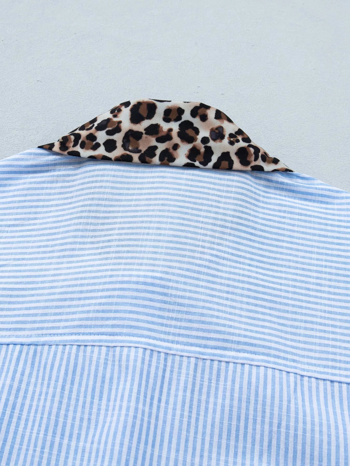 Women's leopard print short sleeve dress with contrast collar from Plush Fashion Hub, featuring a stylish and comfortable design.