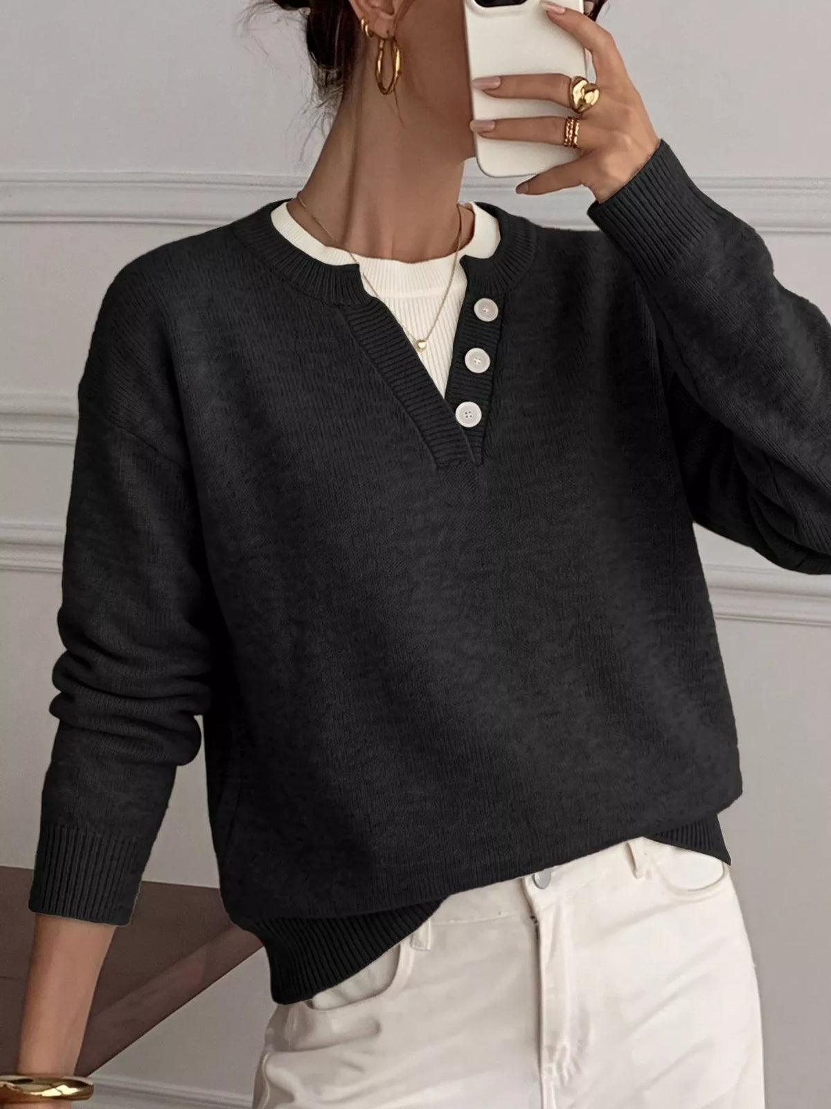 Ribbed knit sweater with button-placket detail, featuring a cozy, fitted design in a neutral color, from Trendsi.